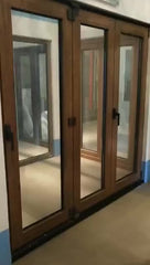 Powder coat aluminum casting glass wood bi folding sliding door price on China WDMA